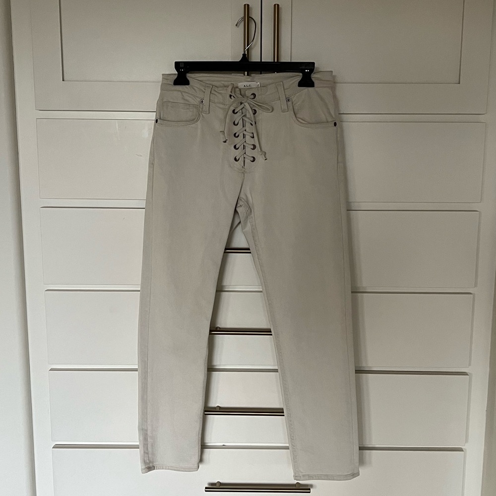 A.L.C jeans with an off white color and lace up front